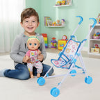 Carrito de muñecas en miniatura.